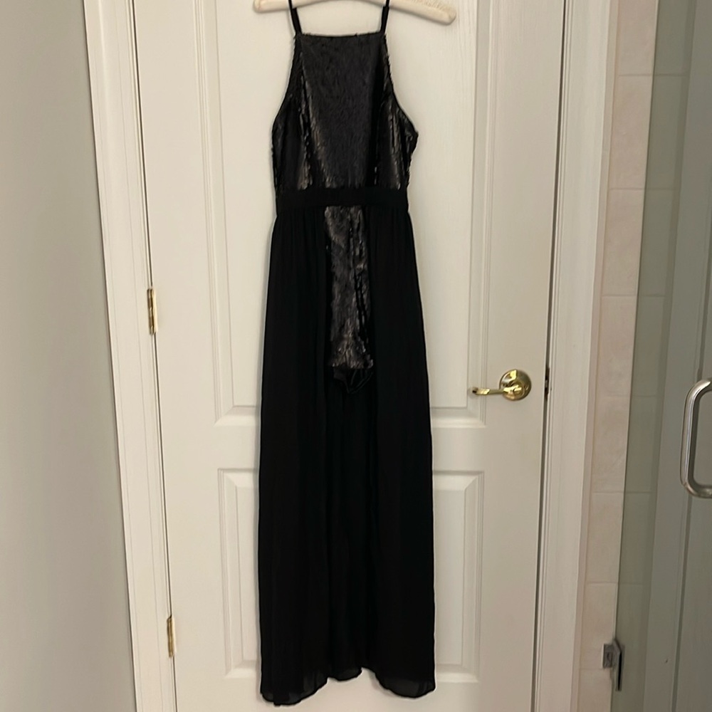 Black jumpsuit with sequin top and shorts. Xs. New with tags.